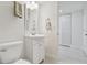 Simple bathroom with white vanity and toilet at 7625 Sun Island S Dr # 305, South Pasadena, FL 33707