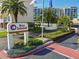 Entrance to Bay Island, featuring a sign and landscaped area at 7625 Sun Island S Dr # 305, South Pasadena, FL 33707