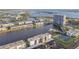 Aerial view of waterfront community, featuring a marina and tennis courts at 7625 Sun Island S Dr # 305, South Pasadena, FL 33707