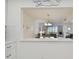 Bright dining area with a view to the living room and balcony at 7625 Sun Island S Dr # 305, South Pasadena, FL 33707