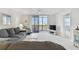 Living room with water views and comfortable seating, showcasing a relaxing atmosphere at 7625 Sun Island S Dr # 305, South Pasadena, FL 33707