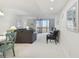 Living room with water views, featuring comfortable seating and ample natural light at 7625 Sun Island S Dr # 305, South Pasadena, FL 33707