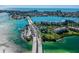 Aerial view of waterfront community, showcasing a bridge and lush surroundings at 7625 Sun Island S Dr # 305, South Pasadena, FL 33707