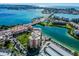 Aerial view of waterfront condo community with pool and parking at 7625 Sun Island S Dr # 305, South Pasadena, FL 33707