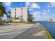 Condo building with waterfront access and BBQ area at 7625 Sun Island S Dr # 305, South Pasadena, FL 33707