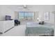Spacious bedroom with king-size bed and large window at 7625 Sun Island S Dr # 305, South Pasadena, FL 33707