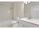 Clean bathroom with a bathtub, toilet and vanity with marble top at 8604 Egret Point Ct, Tampa, FL 33647