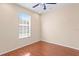 Bright bedroom with hardwood floors and large window at 8604 Egret Point Ct, Tampa, FL 33647