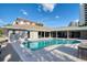 This backyard features a sparkling pool, a lounge deck, and views of the canal at 2773 Seabreeze S Dr, Gulfport, FL 33707