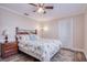 Inviting bedroom with wood floors, ceiling fan, closet and comfortable furnishings at 2773 Seabreeze S Dr, Gulfport, FL 33707