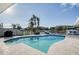 This backyard features a canal view, a pool, and a lounge area for optimal outdoor living at 2773 Seabreeze S Dr, Gulfport, FL 33707