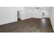 Bright living room with dark gray vinyl plank flooring at 29502 Fedora Cir, Brooksville, FL 34602