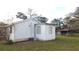 One story home with a separate addition and AC unit at 38029 Causey Rd, Dade City, FL 33523