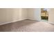 Spacious carpeted bedroom with sliding glass doors at 562 Rivercrest Ln, Tarpon Springs, FL 34689