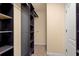 Large walk-in closet with shelves and hanging rods at 562 Rivercrest Ln, Tarpon Springs, FL 34689