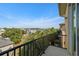 Private balcony with view of neighborhood and water at 562 Rivercrest Ln, Tarpon Springs, FL 34689