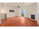 Bright living room with hardwood floors, fireplace, and access to balcony at 562 Rivercrest Ln, Tarpon Springs, FL 34689