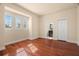 Bedroom with wood floors and access to bathroom at 562 Rivercrest Ln, Tarpon Springs, FL 34689