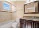 Bathroom with granite countertop and a bathtub at 562 Rivercrest Ln, Tarpon Springs, FL 34689