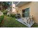 Relaxing patio with grill and chairs, ideal for outdoor dining at 562 Rivercrest Ln, Tarpon Springs, FL 34689