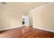 Hardwood floor bedroom with access to a bathroom at 562 Rivercrest Ln, Tarpon Springs, FL 34689