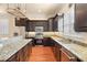 Modern kitchen with stainless steel appliances and granite countertops at 562 Rivercrest Ln, Tarpon Springs, FL 34689