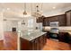 Spacious kitchen with granite countertops and stainless steel appliances at 562 Rivercrest Ln, Tarpon Springs, FL 34689