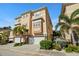 Beautiful 3 story tan townhouse with 3 car garage at 562 Rivercrest Ln, Tarpon Springs, FL 34689
