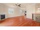 Living room with hardwood floors, fireplace, and built-in shelving at 562 Rivercrest Ln, Tarpon Springs, FL 34689