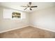 Bedroom with ceiling fan and window with shutters at 6431 Butte Ave, New Port Richey, FL 34653