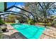 Inviting screened pool with spacious patio at 9085 Leisure N Ln, Largo, FL 33773