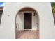 Home features arched entryway with decorative wrought iron security door at 10181 Gamewell St, Spring Hill, FL 34608