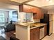 Kitchen with granite countertops, stainless steel appliances and breakfast bar at 10200 Gandy N Blvd # 921, St Petersburg, FL 33702