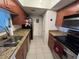 Galley-style kitchen with granite countertops and stainless steel appliances at 10200 Gandy N Blvd # 921, St Petersburg, FL 33702