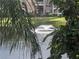 Partial view of a lake and fountain from a balcony at 10200 Gandy N Blvd # 921, St Petersburg, FL 33702