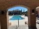 Resort-style community pool with brick arch entryway at 10200 Gandy N Blvd # 921, St Petersburg, FL 33702