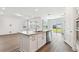 A contemporary kitchen is equipped with a eat-in island and stainless steel appliances at 11207 Shoreline Trl, Parrish, FL 34219