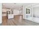 Open-concept living space featuring plank flooring, recessed lighting, and access to the patio at 11207 Shoreline Trl, Parrish, FL 34219
