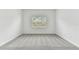 Bright bedroom with gray carpet and a window offering natural light at 11517 Waterway Dr, Parrish, FL 34219