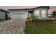Charming single-Gathering home with a two-car garage, paved driveway, and well-manicured front lawn at 11517 Waterway Dr, Parrish, FL 34219
