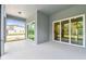 Covered patio with gray walls, ceiling light, and a view of the yard and surrounding houses at 11517 Waterway Dr, Parrish, FL 34219