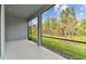 Screened lanai offers serene views of lush green backyard with privacy and mature trees at 11517 Waterway Dr, Parrish, FL 34219