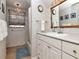 Clean bathroom with a tub shower combination and updated vanity at 1904 S Hesperides St, Tampa, FL 33629