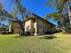 Exterior view of the building and landscaping at 2671 Sabal Springs Cir # 102, Clearwater, FL 33761