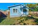 House's backyard view, featuring a patio and fenced area at 2905 E 21St Ave, Tampa, FL 33605