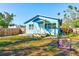 House's backyard view with patio and walkway at 2905 E 21St Ave, Tampa, FL 33605