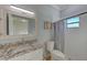 Modern bathroom with granite countertop and subway tile at 2905 E 21St Ave, Tampa, FL 33605