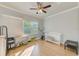 Bright bedroom with hardwood floors, large windows, and plenty of space at 2905 E 21St Ave, Tampa, FL 33605