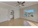 Spacious bedroom with ceiling fan and en-suite bathroom at 2905 E 21St Ave, Tampa, FL 33605