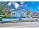 Quaint light blue house with a front yard and walkway at 2905 E 21St Ave, Tampa, FL 33605